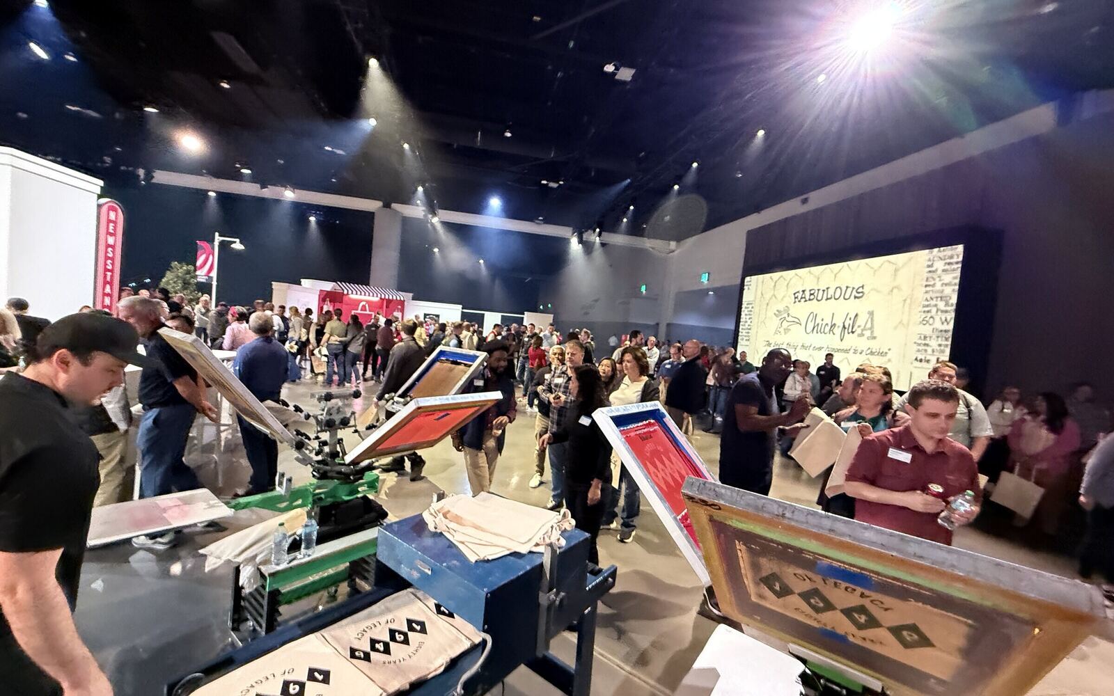 Corporate t-shirt printing station running at a company event booth